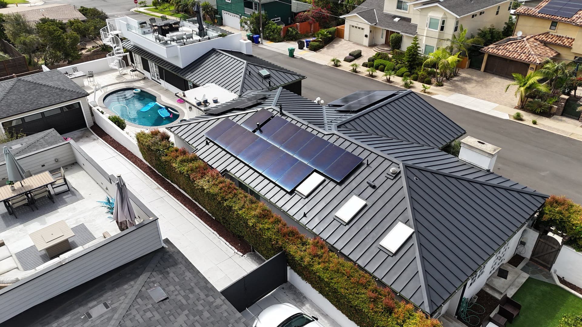 Sleek Metal Roof Installation with Solar Integration image